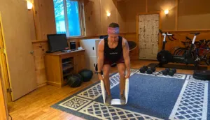 A large towel can be used as an alternative weight to mimic a deadlift.