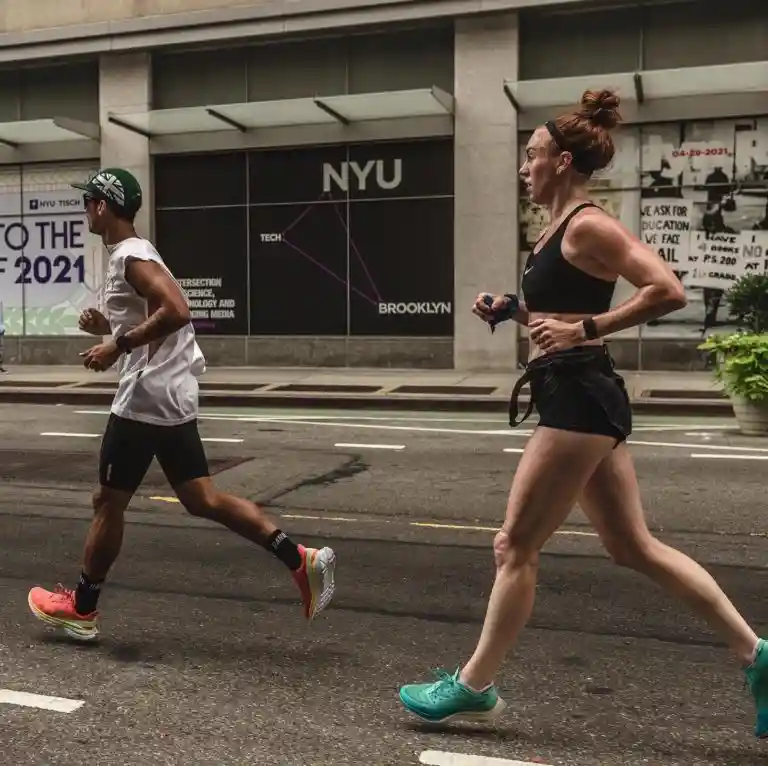 Coach Meg Takacs running